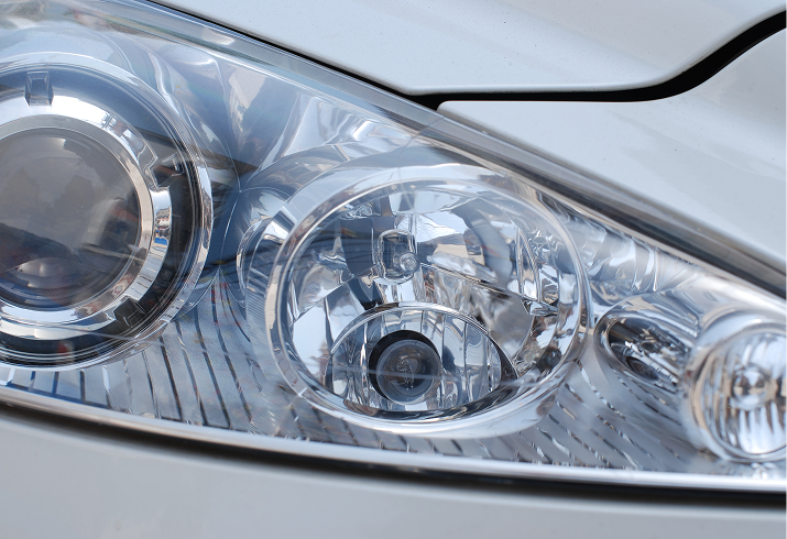 Close-up of a car headlight assembly.